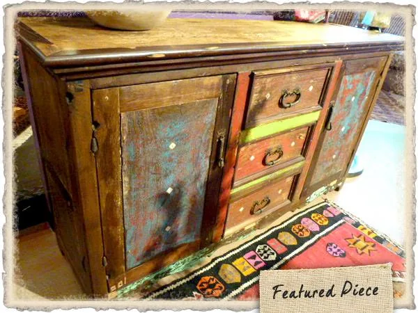 Distressed wood sideboard with painted doors and drawers in blue, red and green